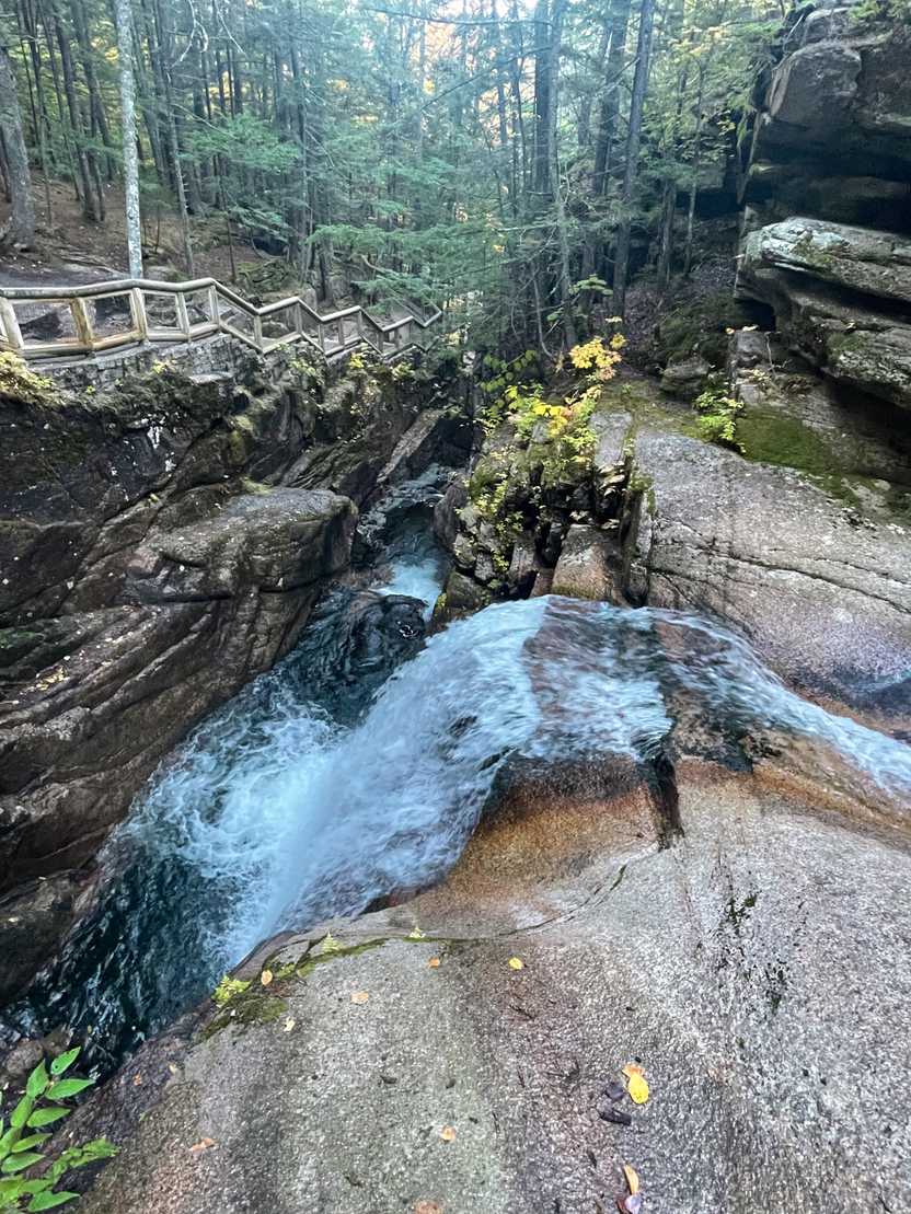 Looking down at Sabbaday Falls from the side. You can see the trail that goes in front of the waterfall.