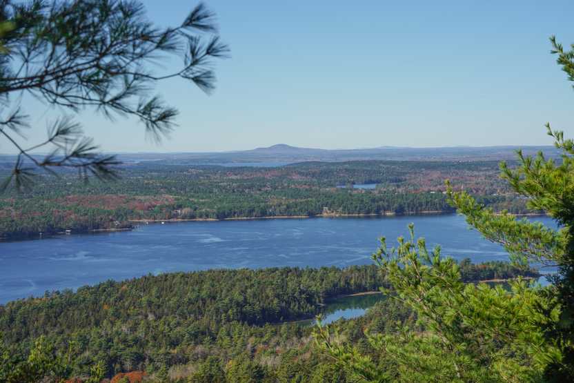 A few lakes surrounded by rolling hills and trees, seen from the Carriage Roads in Acadia.