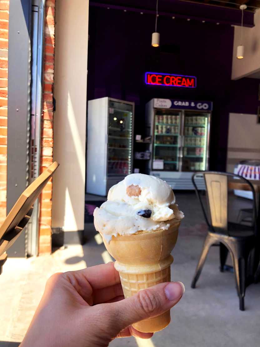 A scoop of ice cream on a cake cone at Josh & John's Ice Cream
