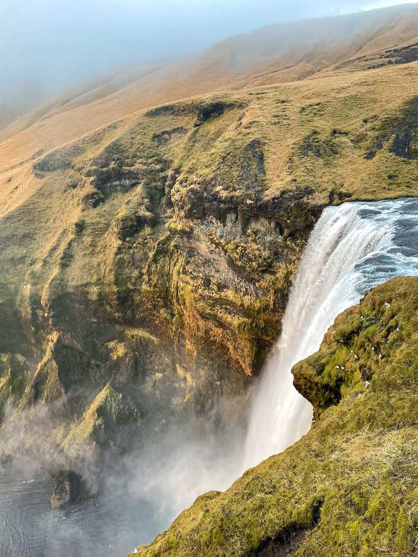 Looking down at Skógafoss from above.