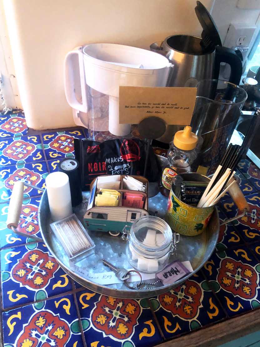 A tray with sugar, salt and pepper and other necessities inside of the trailer.