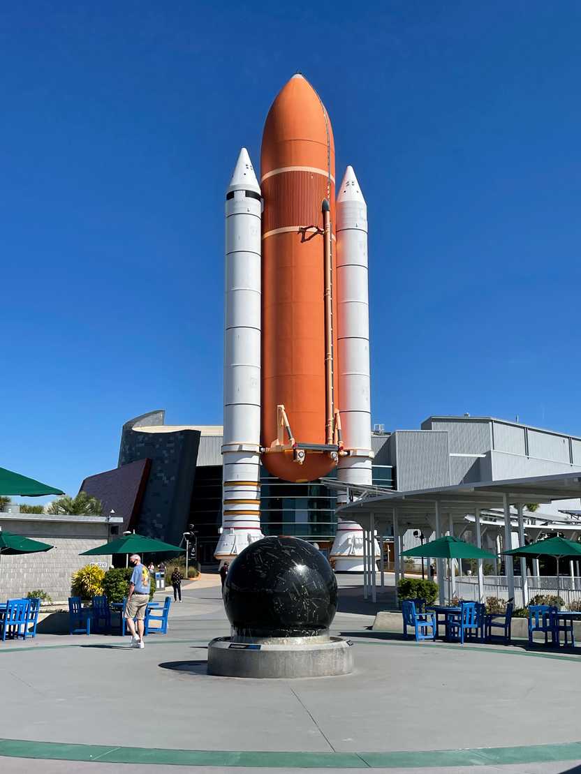 A large orange rocket standing up right. A large orange rocket standing up right.