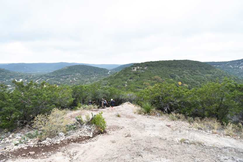 Some hikers going down the Mt Baldy trail with an amazing view of surrounding hills.