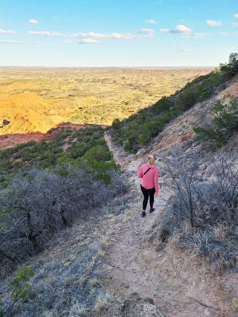 Lydia hiking down the path from the Haynes Ridge Overlook