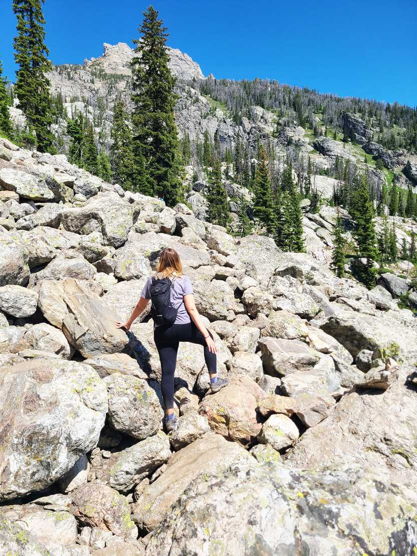 Lydia standing on the boulder field on the way to Delta Lake.