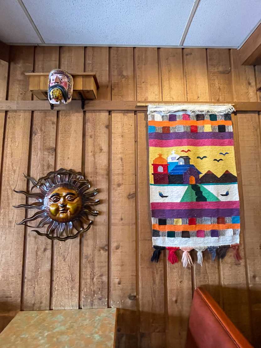 A wall with colorful artwork at Bravor Burrito A wall with colorful artwork at Bravor Burrito