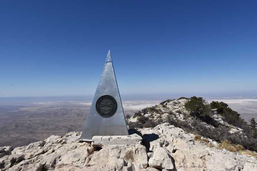 A large metal pyramid on the top of Guadalupe Peak at Guadalupe Mountains National Park.