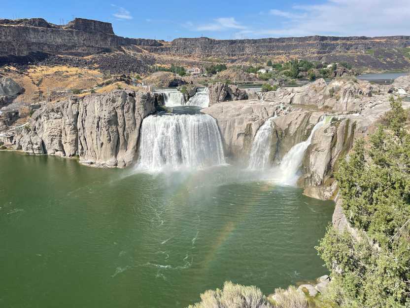 A view of Shoshone Falls with a rainbow near the falls.