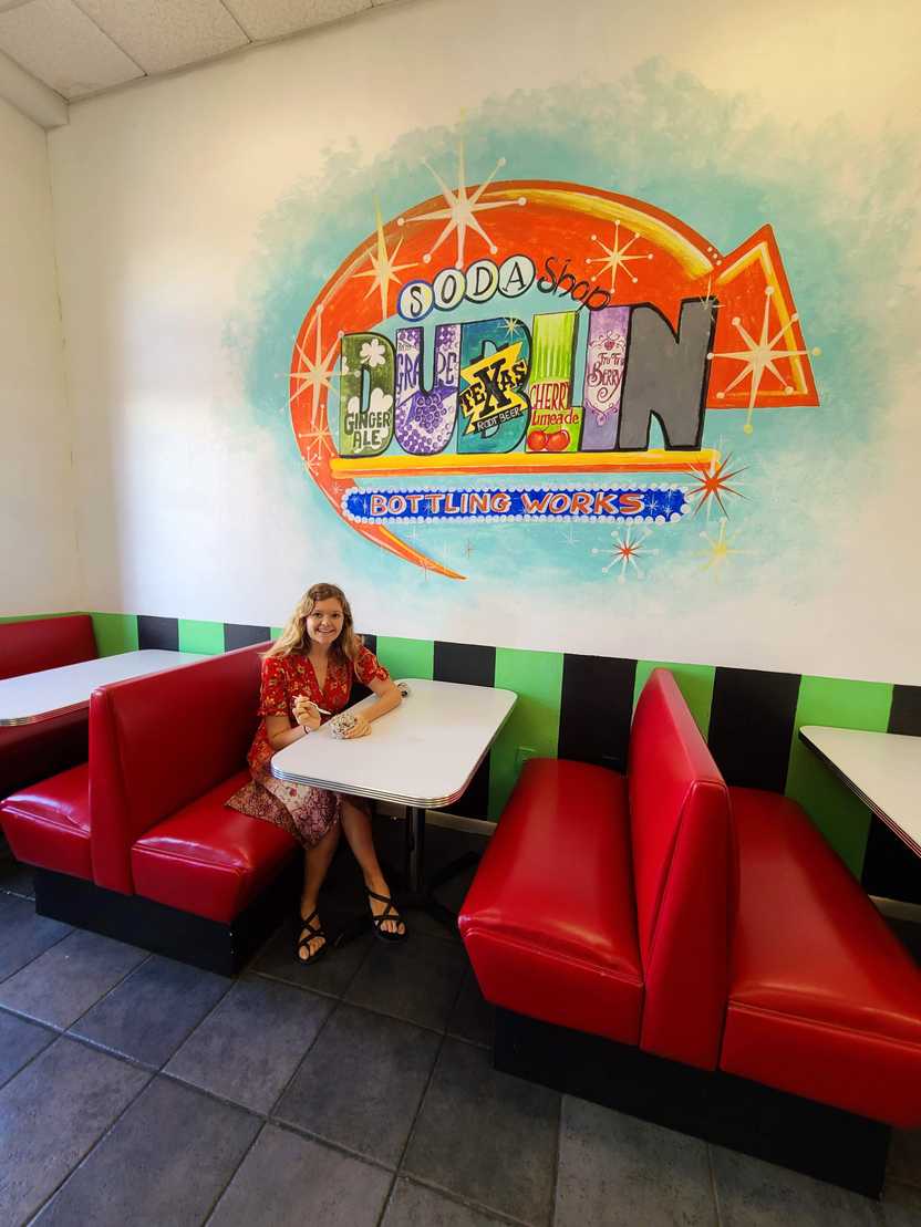 Lydia sitting in a bottle at Old Doc's Soda Shop