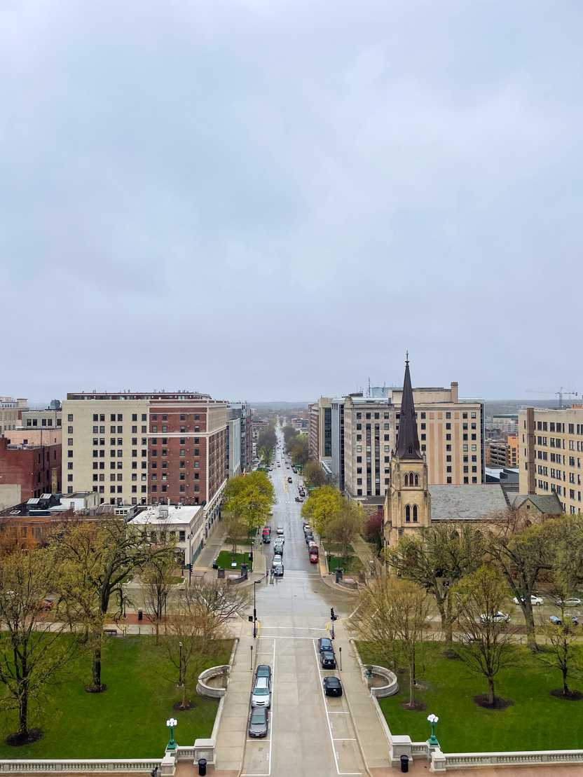 A view looking straight down a street in downtown Madison from the state capitol observation deck.
