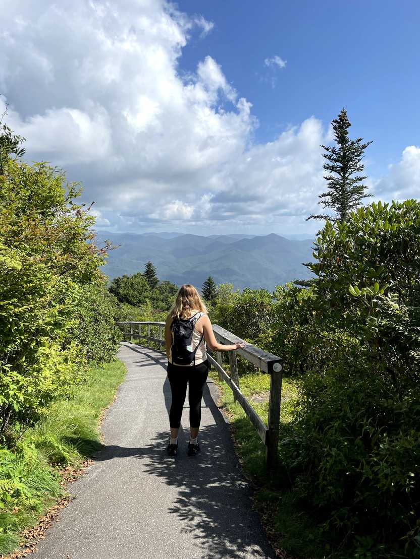 Lydia looking out at the mountain view on the way down the trail to Waterrock Knob.