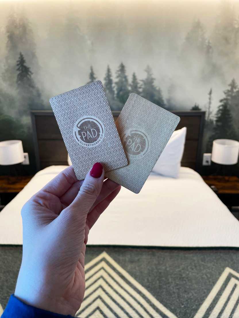 Holding The Pad room keys, which are embossed wood Holding The Pad room keys, which are embossed wood