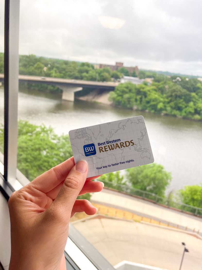 A hand holding a Best Western room key overlooking the Mississippi River A hand holding a Best Western room key overlooking the Mississippi River