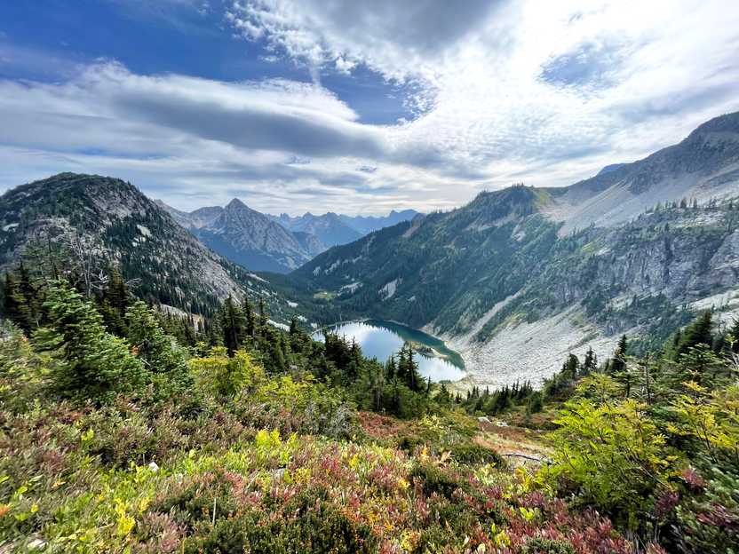 A view of mountains and a small lake on the Maple Pass trail.