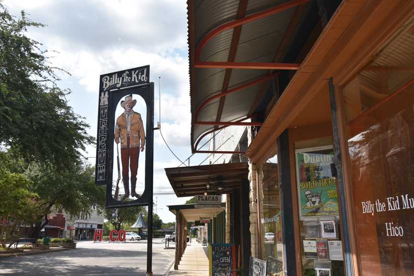 A large "Billy the Kid" sign a cowboy figure.