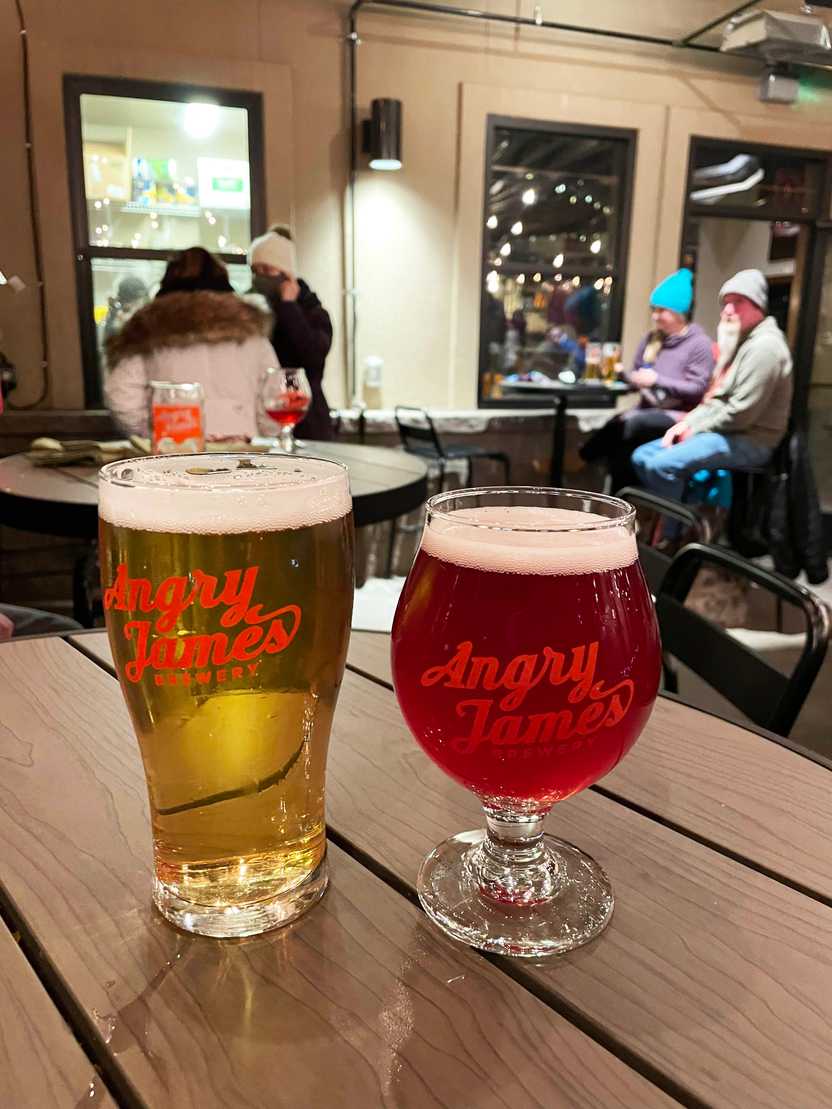 Two glasses of beer on a barrel in Angry James brewery. Two glasses of beer on a barrel in Angry James brewery.