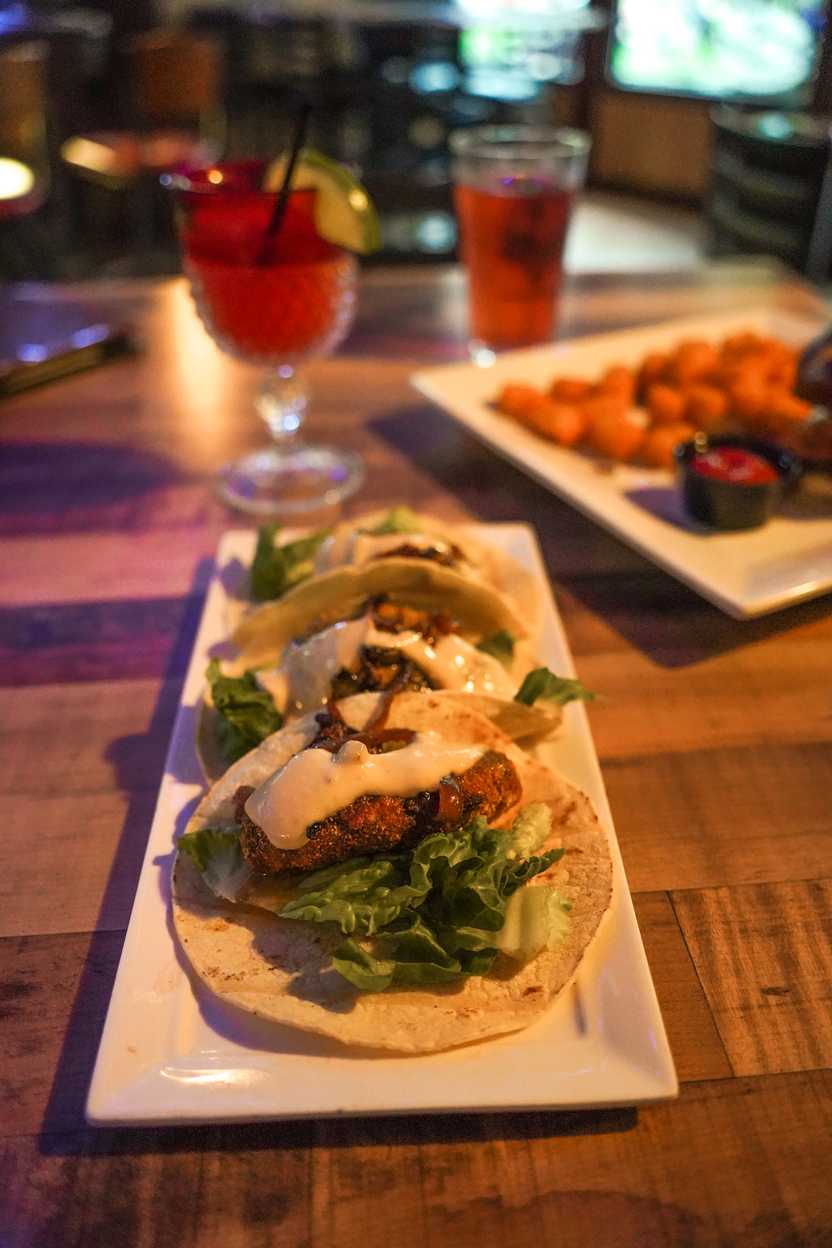 A plate of 3 tacos on a table at Pickled Loon A plate of 3 tacos on a table at Pickled Loon