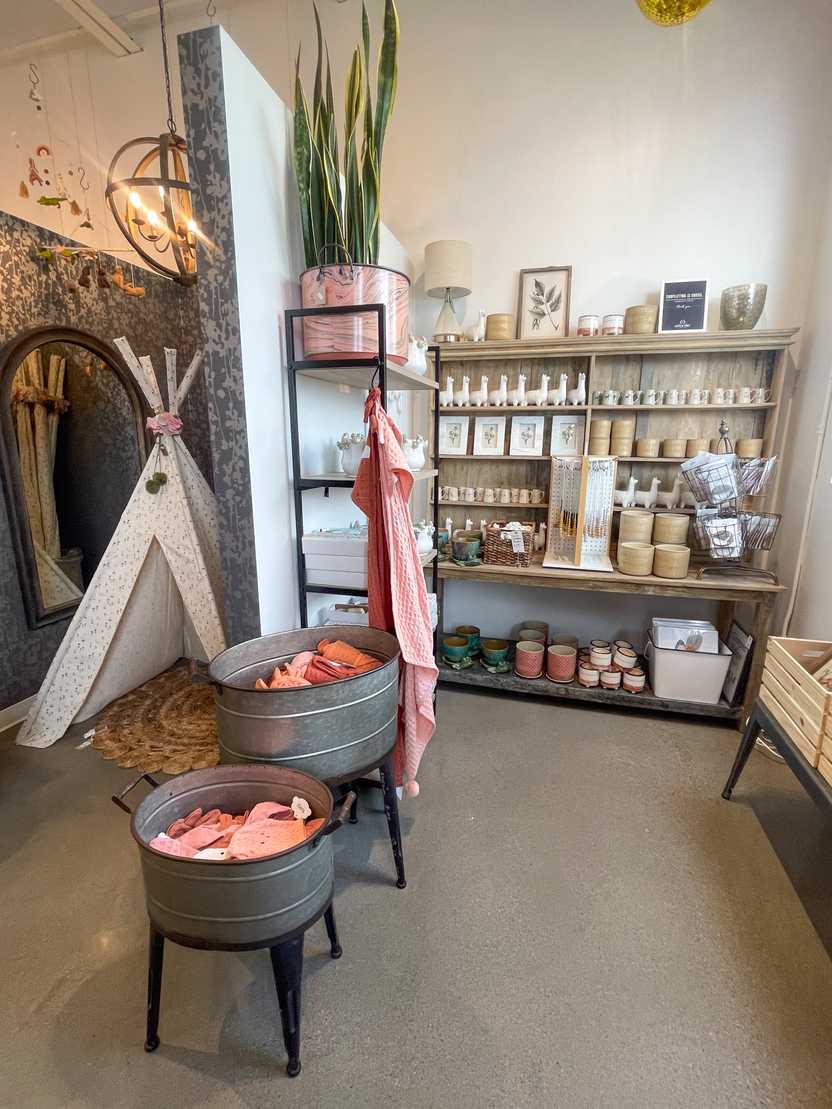 A room with a shelf and shelves full of items inside Copper Pony A room with a shelf and shelves full of items inside Copper Pony