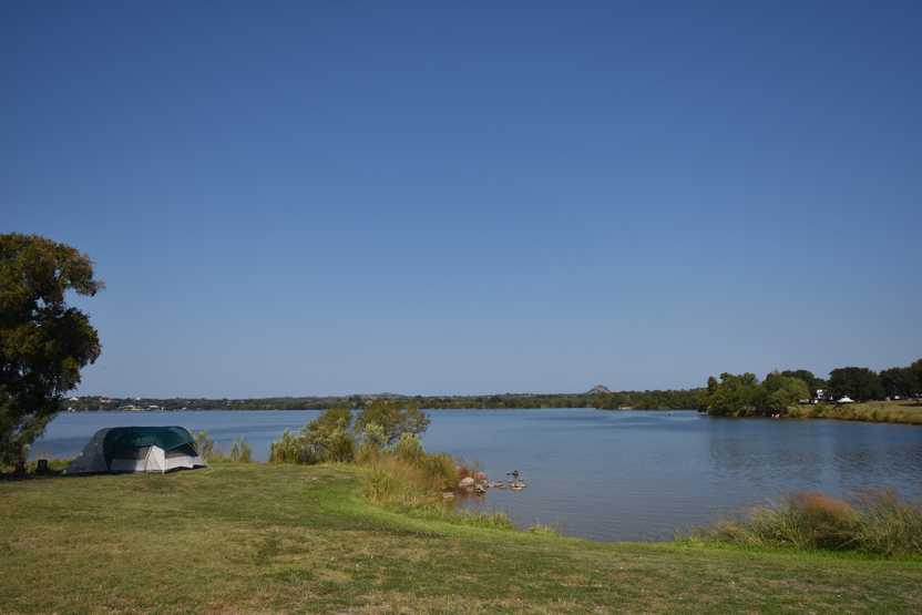 A tent next to the water at Inks Lake State Park.