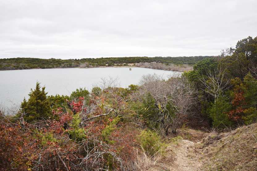 A view looking down at Cedar Lake in Cleburne State Park