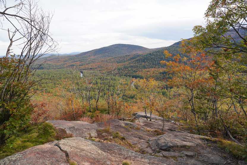 A view of hills with colorful foliage from the Boulder Loop Trail