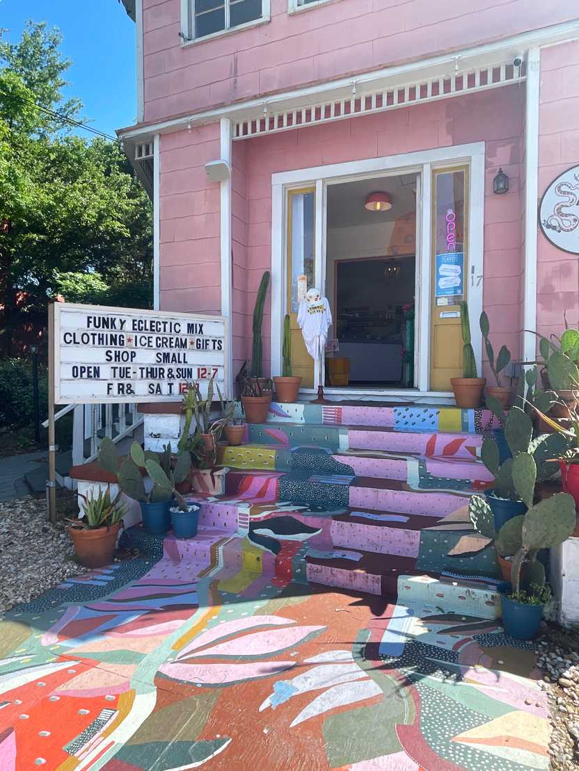 Floral, painted steps leading up a pink building, Starland Bazaar
