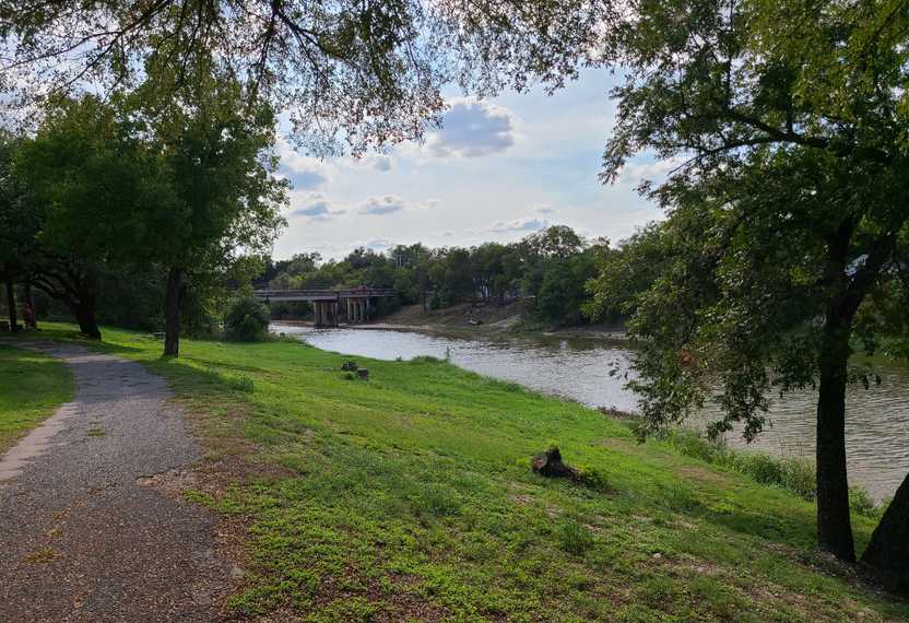 A path next to a river at the Paluxy Heritage Park.