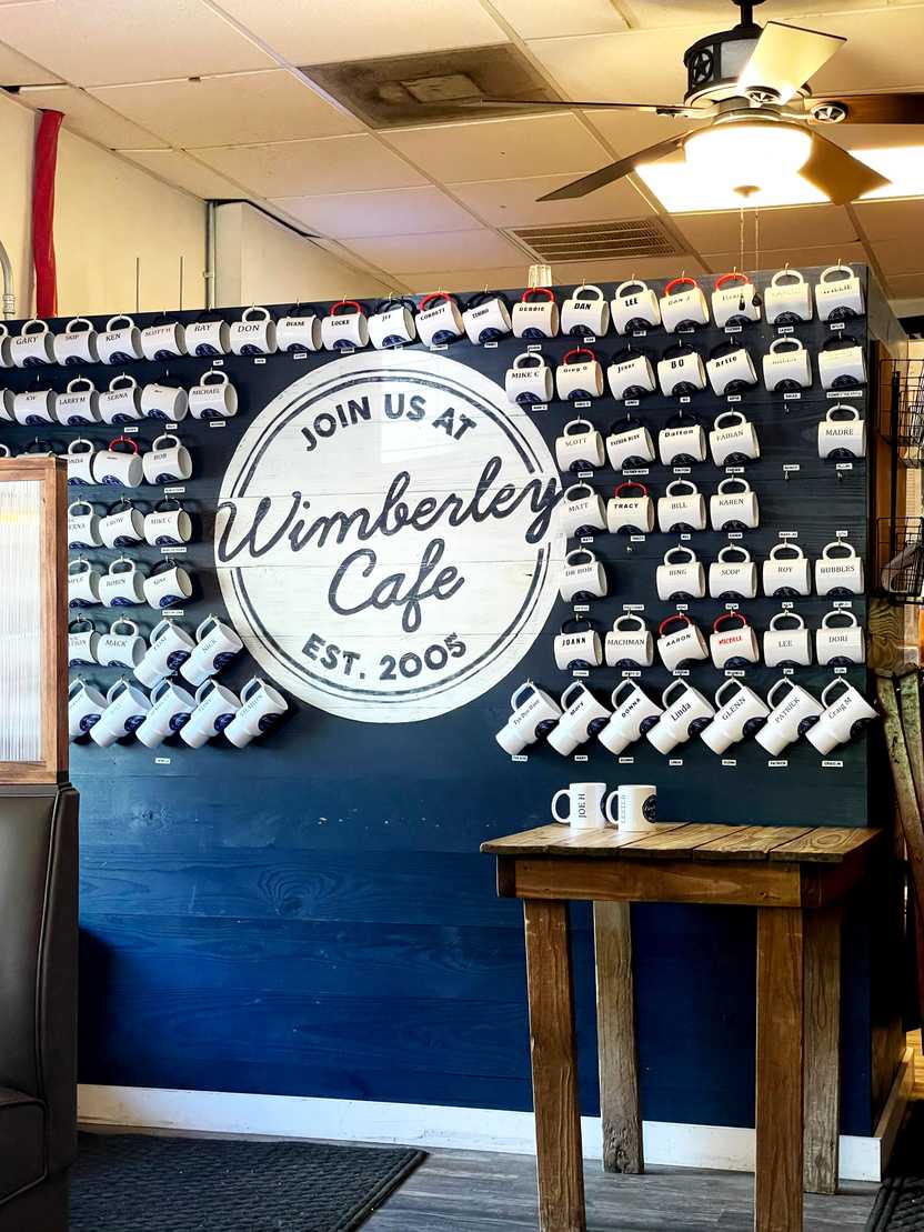 A wall of coffee mugs at Wimberley Cafe. A wall of coffee mugs at Wimberley Cafe.