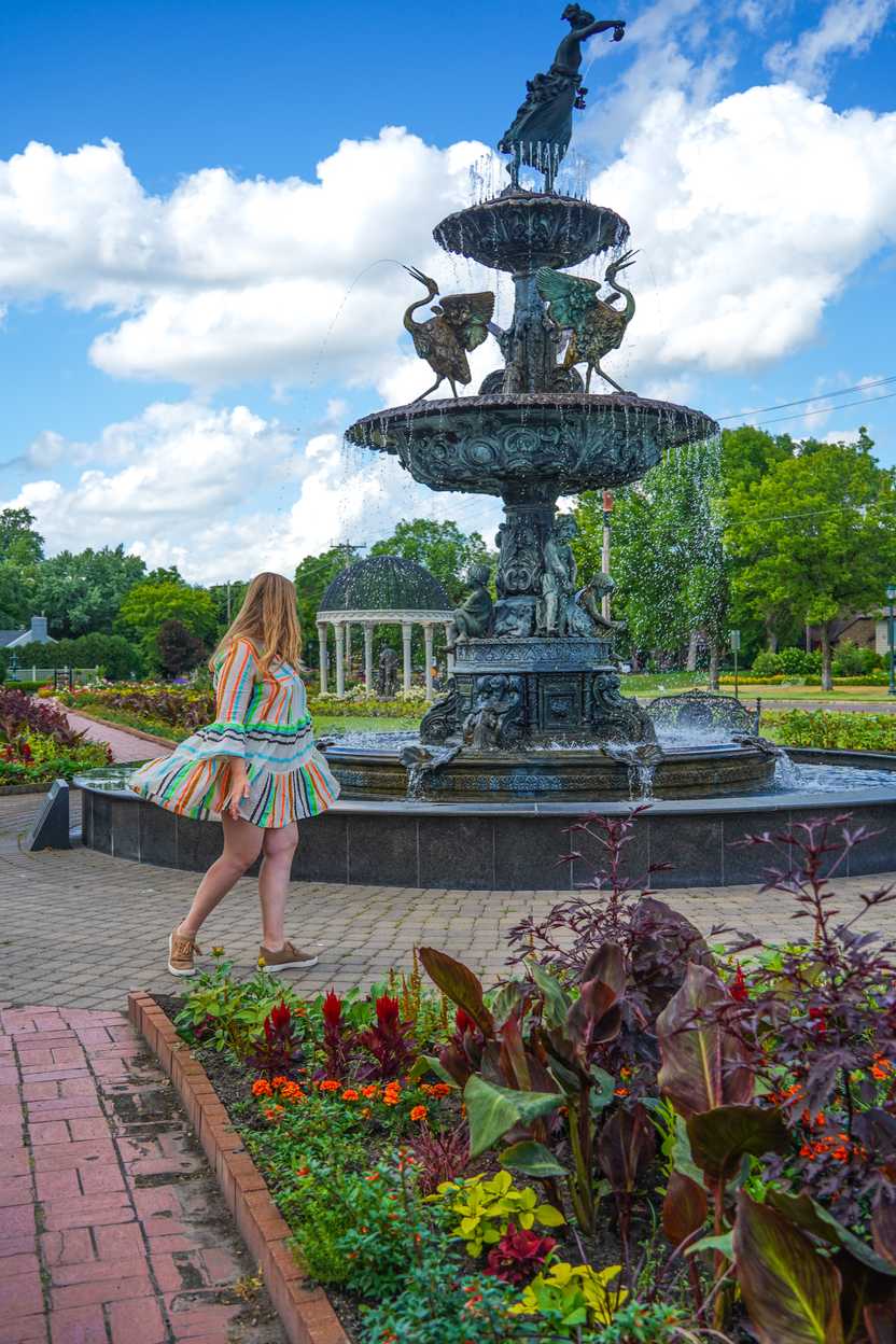 Lydia walking near a fountain at Munsinger Gardens Lydia walking near a fountain at Munsinger Gardens