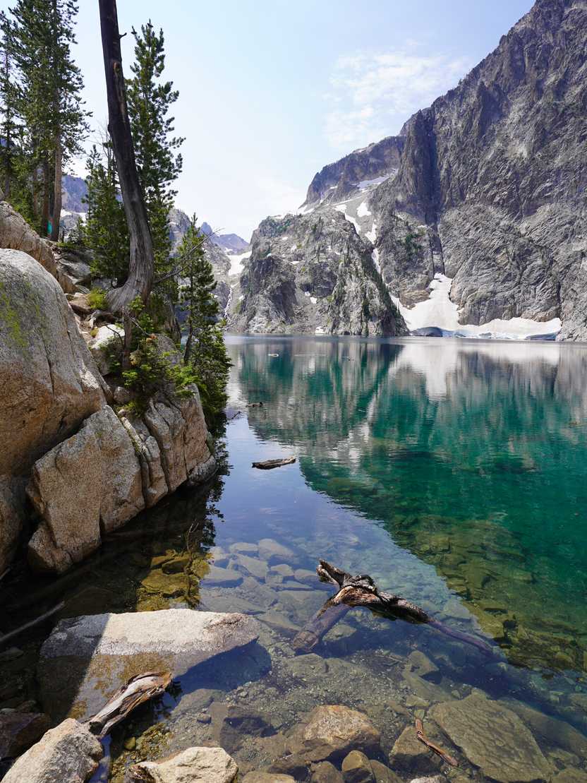 A bright blue lake with a mountain across the water. A bright blue lake with a mountain across the water.