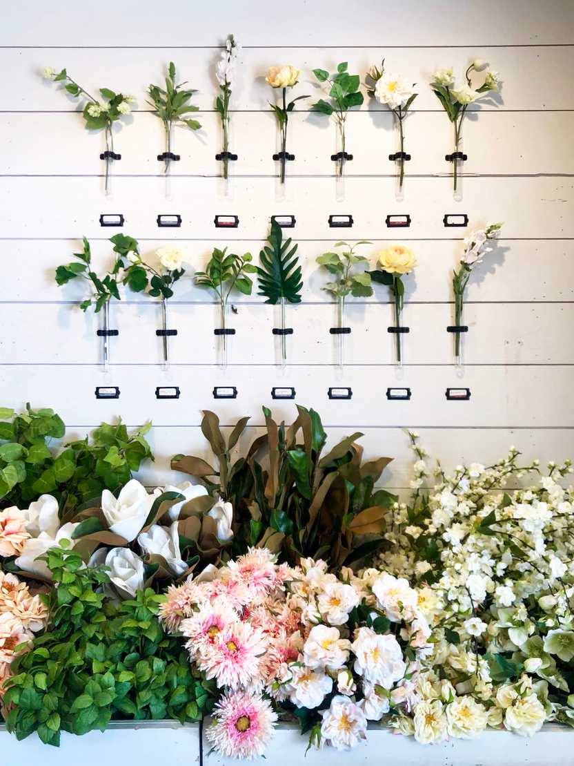 A wall of flowers and various greenery at the Magnolia Silos. A wall of flowers and various greenery at the Magnolia Silos.