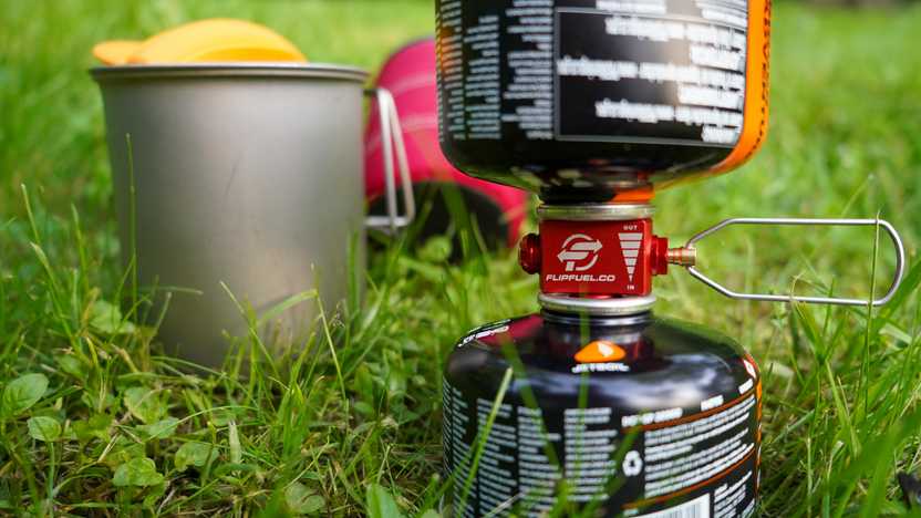 A close up look at a FlipFuel between two fuel canisters. A close up look at a FlipFuel between two fuel canisters.