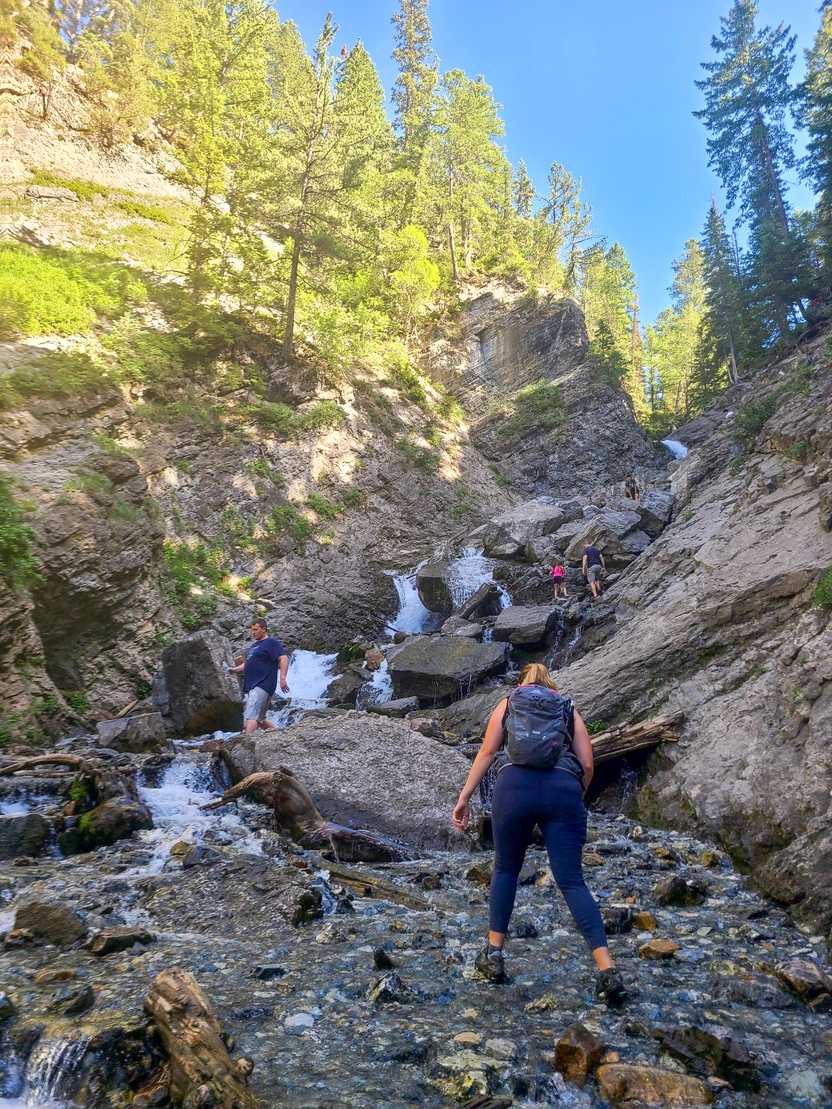 Lydia hiking towards the scramble section that leads up to Donut Falls.