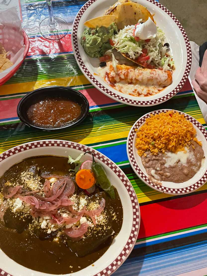 Two plates of Mexican food from Red Iguana