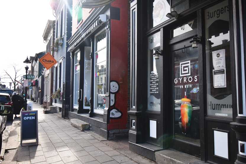 A street in Mainstrasse Village in Covington. There is a gyros restaurant and a bakery.
