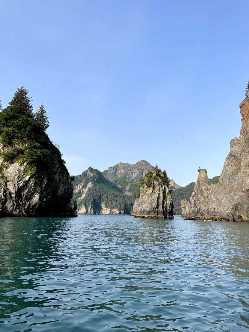 A view of Cove of the Spires, jagged rocks sticking out of the water.