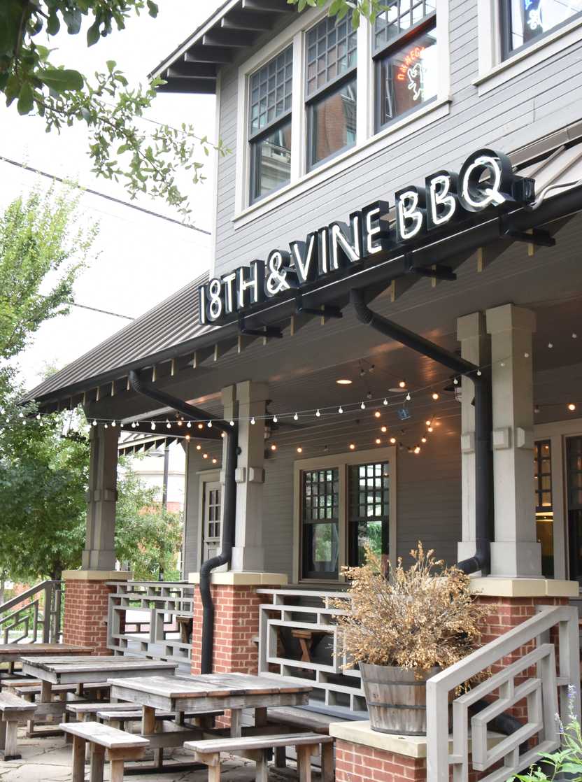 The exterior of 18th and Vine. There is a patio area in front.