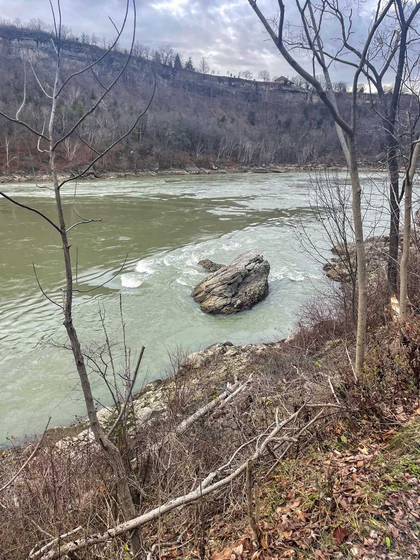 A wide river seen along the trail at Devil's Hole State Park.