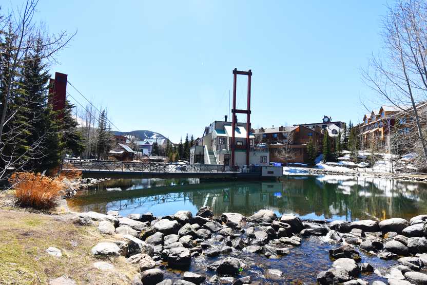 A view of a river with a bridge in Breckenridge.