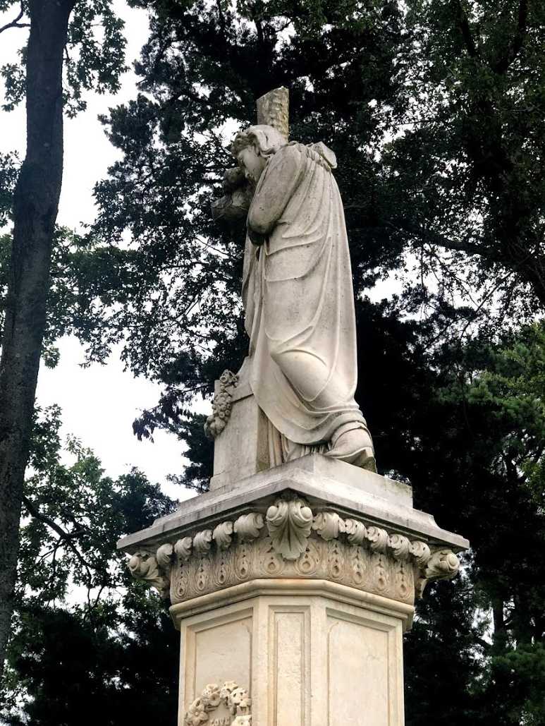 A close up view of Jesus wearing cowboy boots.