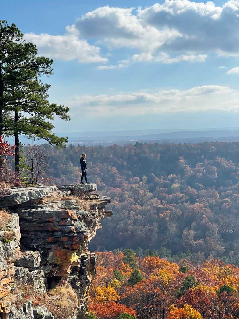 Lydia standing on a rock at an overlook in Petit Jean State Park.