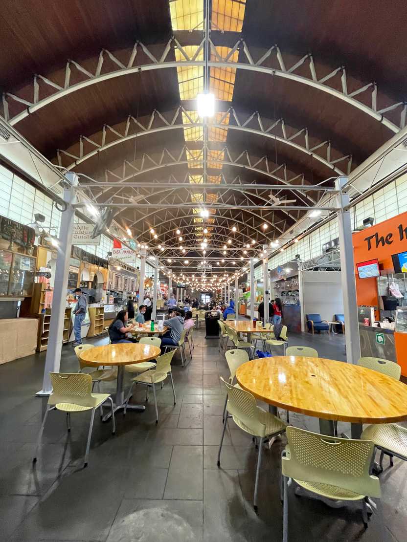 The inside of the Little Rock River Market. There are tables in the center, food vendors on the sides and an arch in the ceiling above. The inside of the Little Rock River Market. There are tables in the center, food vendors on the sides and an arch in the ceiling above.