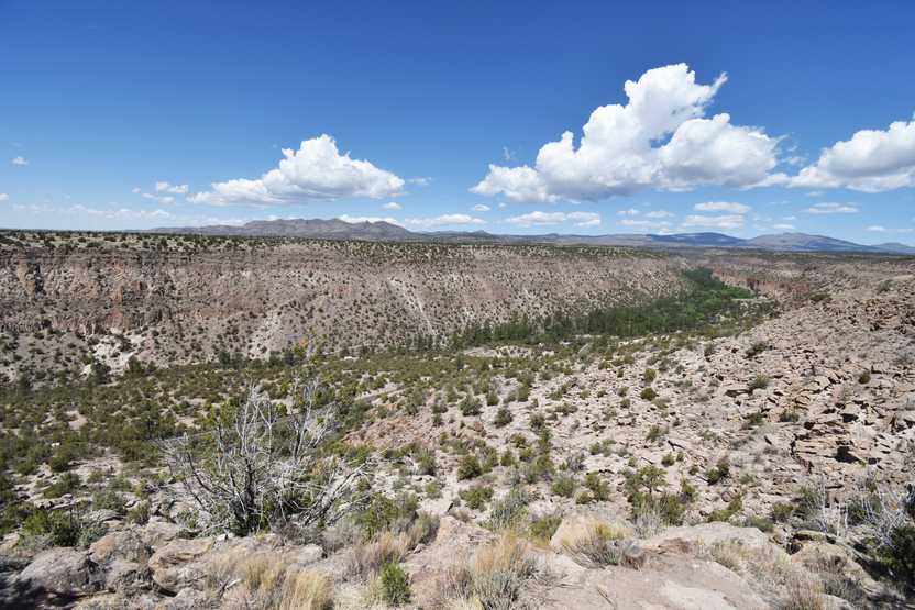 A view of a valley at Banelier National Monument from an overlook. You can see the road at the bottom of the valley.